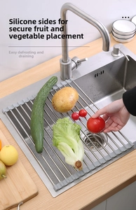 Detail of a foldable stainless steel roll-up sink drying rack with non-slip silicone edges