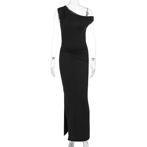Detail of elegant black one-shoulder dress with waist knot and side slit feature