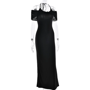 Close-up of mesh off-shoulder neck detail on a black bodycon floor-length dress