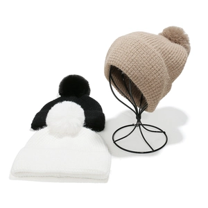 Solid knit beanie hats with pom pom for women in white black and beige colors