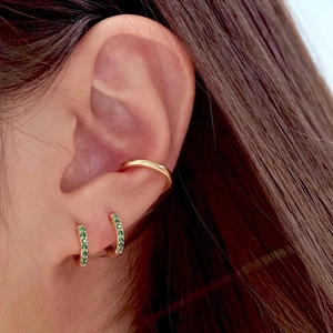 Classic gold hoop earrings with green zircon pave stones and a matching ear cuff set
