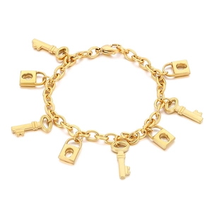 18K gold plated stainless steel chain bracelet with lock and key charms on white background