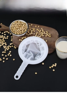 Close-up of fine mesh food strainer with ergonomic handle for soybean milk and juice
