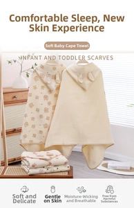 Detail of hooded baby poncho towel with cute animal ears and soft cotton gauze fabric