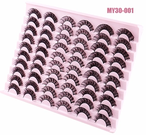 Detailed close-up of 30 pairs of dense black Russian curl false eyelashes on a pink tray