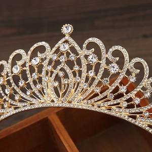 Close-up of luxury gold alloy crown featuring intricate rhinestones and crystals