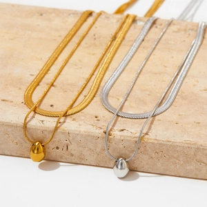 Double layered gold and silver teardrop pendant necklace with sleek snake chains