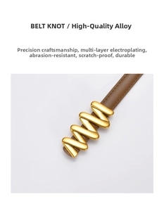 Macro detail of brown leather belt with elegant wave-shaped gold knot buckle clasp