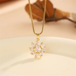 Elegant gold flower necklace with zircon crystal pendant on a classic box chain