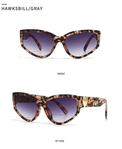 Detail view of tortoiseshell cat eye sunglasses with purple gradient lenses and metal heart