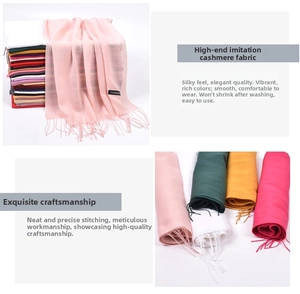 Detail shot of multicolor faux cashmere scarves with soft fringe and smooth texture