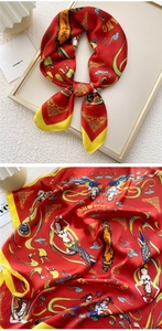 Detail of Dunhuang flying apsaras printed silk scarf featuring red and yellow contrast