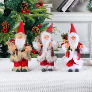 Three-piece set of standing Santa Claus figurines for Christmas home decor displays