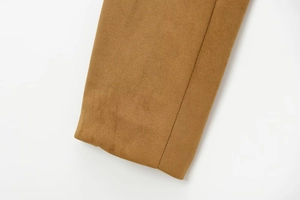 Close-up of premium camel suede leather sleeve with professional stitching detail