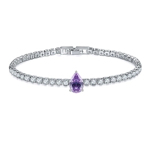 Detailed close-up of a silver tennis bracelet with cubic zirconia and a purple pear-shaped stone