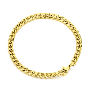 Polished gold curb link chain bracelet with lobster clasp on white background