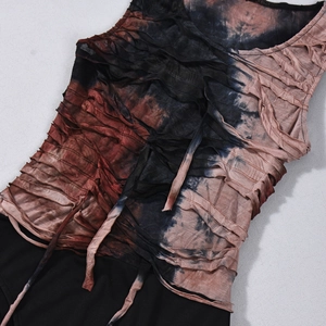 Detail showing tie-dye pattern and pleated fabric texture of sleeveless bodysuit