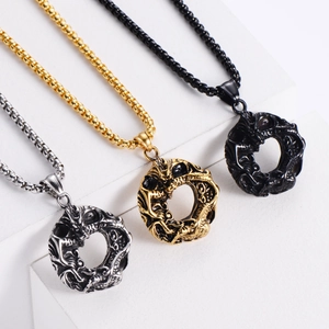Detailed trio of vintage dragon relief necklaces in silver, gold, and black finishes