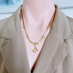 Elegant gold snake chain necklace for women featuring heart stones and a butterfly pendant