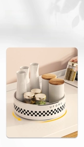 Close-up of a 360-degree rotating spice organizer with a stylish checkered pattern base