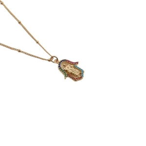 Golden Hamsa necklace featuring colorful zircons and a central figure on a bead chain