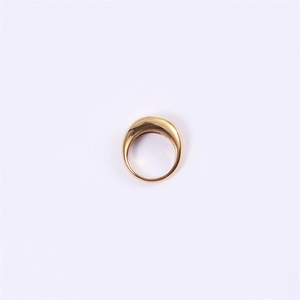 Detailed macro view of the polished golden curved dome ring with minimalist teardrop design