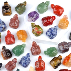 Collection of carved crystal tortoise figurines in various natural semi-precious gemstones