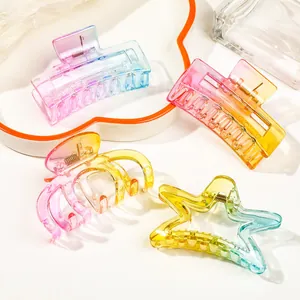 Detail of colorful gradient transparent hair claws in various geometric shapes and styles
