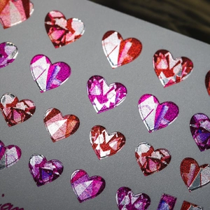 Laser holographic heart nail art stickers with metallic gold finish and geometric facets