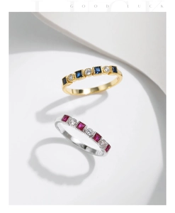 Detail of s925 silver rings with colorful gemstones and pavé diamonds in gold and silver