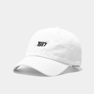 White cotton 1987 embroidery baseball cap with curved brim and soft top crown