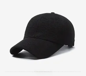 Side view of black baseball cap featuring a unique seersucker crinkle texture fabric