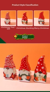 Detailed view of three festive Christmas gnome tin boxes for candy and holiday treats