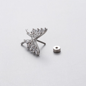Silver butterfly cartilage earring with marquise stone and screw back on grey background