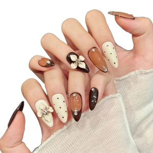 Caramel leopard cat-eye press-on nails with 3D floral relief and rhinestone accents