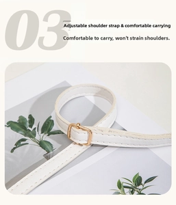 Detail of adjustable white leather strap with gold metallic buckle for camera bag