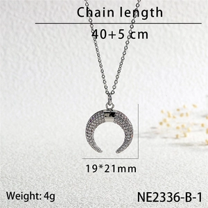 Detail shot of silver horn pendant with zircon pavé showing 19x21mm dimensions