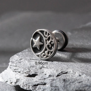 Detailed view of silver stud earring with engraved star moon motif and 0.96cm size guide
