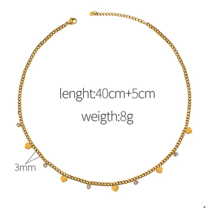Golden titanium heart and zircon pendant necklace with adjustable chain on white background