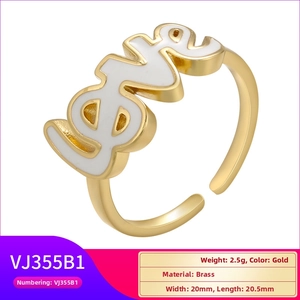 Detail of golden adjustable ring featuring white enamel LOVE lettering and polished brass finish