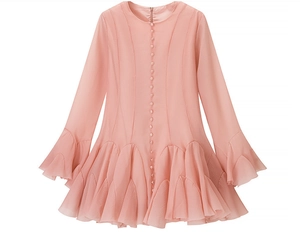 Detail of light pink mini dress featuring ruffled hem and single-breasted button closure