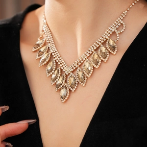 Exquisite necklace with champagne crystals in a V-shaped design on a model's neckline