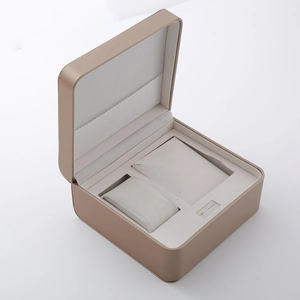 Elegant champagne gold watch and jewelry gift box with soft white interior pillows