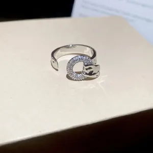 Adjustable silver ring with sparkling zircon circle and panther head design detail