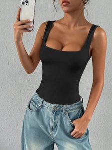 Y2K style black slim fit tube top with square neck paired with blue jeans