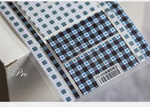 Detailed view of TS-389 5D plaid nail stickers with blue and black checkered patterns
