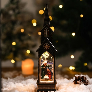 Illuminated vintage bronze church with nativity scene and snow base for Christmas decor