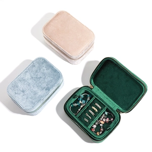 Portable velvet jewelry organizers in pink blue and green with zip closure and ring slots