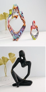 Modern abstract resin thinker sculptures in colorful graffiti and black gold marble patterns