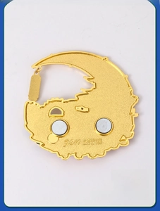 Macro detail of crescent moon metal fridge magnet featuring double magnetic back design
